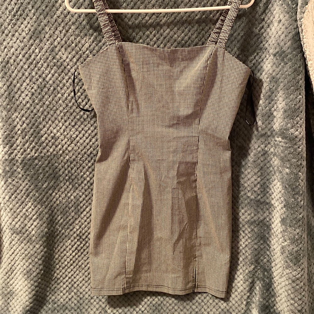 Brand new never used ! Tight black/white dress with small slit on the side :)